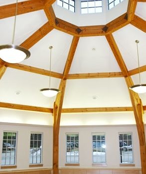 Posts for the Thelma Babbitt Room — an octagonal, post-and-beam meeting space — were milled from white pine grown on Harris Center lands. The huge rafters and compression ring were recycled from a mill building in Massachusetts.