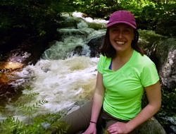Courtney Dillon pauses by a waterfall in spring melt.