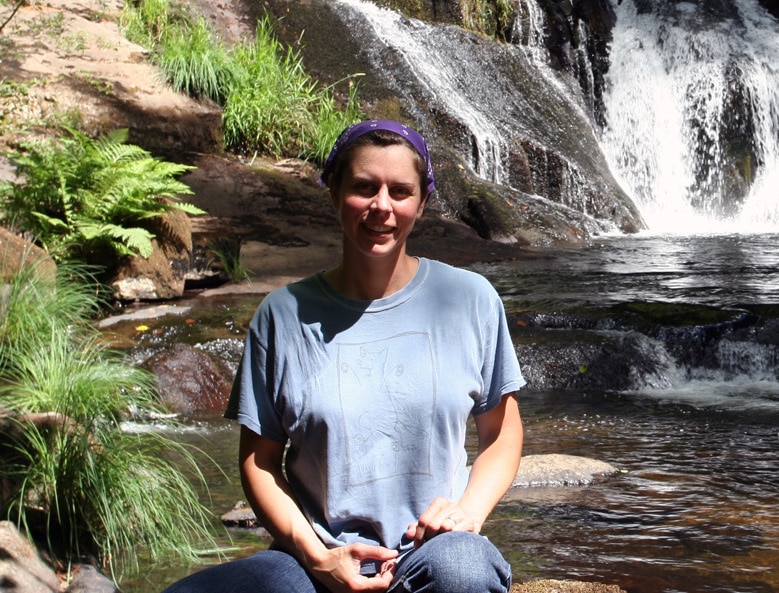 Jocelyn Duffy pauses beside a West Coast waterfall.
