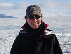 Katie Koster smiles in Antarctica.
