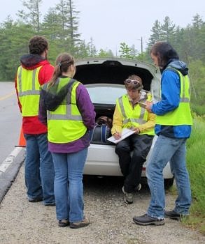 The 2015 conservation internship team prepares to conduct a wildlife road mortality survey. (photo © Brett Amy Thelen)