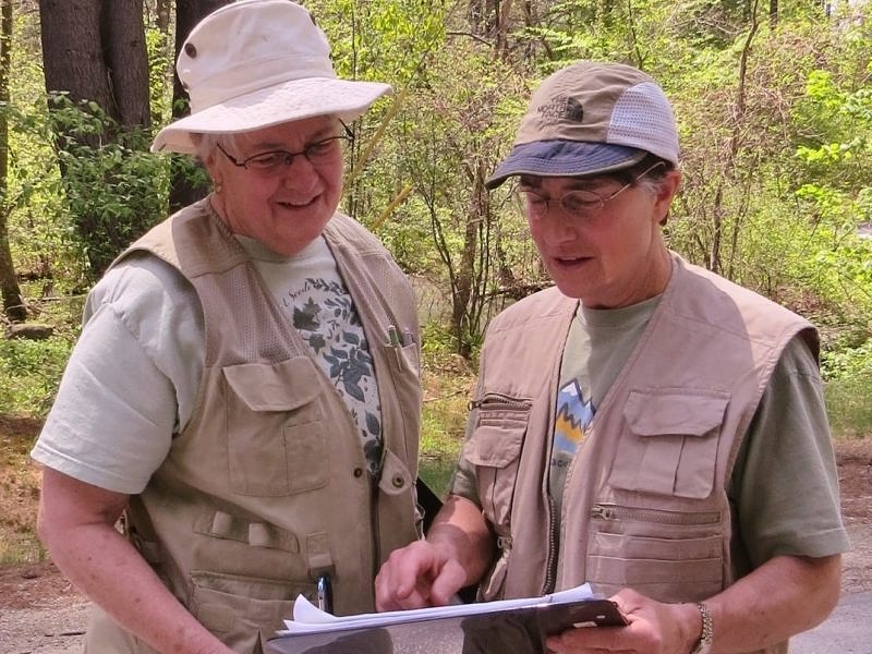 Karen and Susan Sielke, longtime citizen scientists with the Harris Center, consult their clipboard. (photo © Cynthia Nichols)