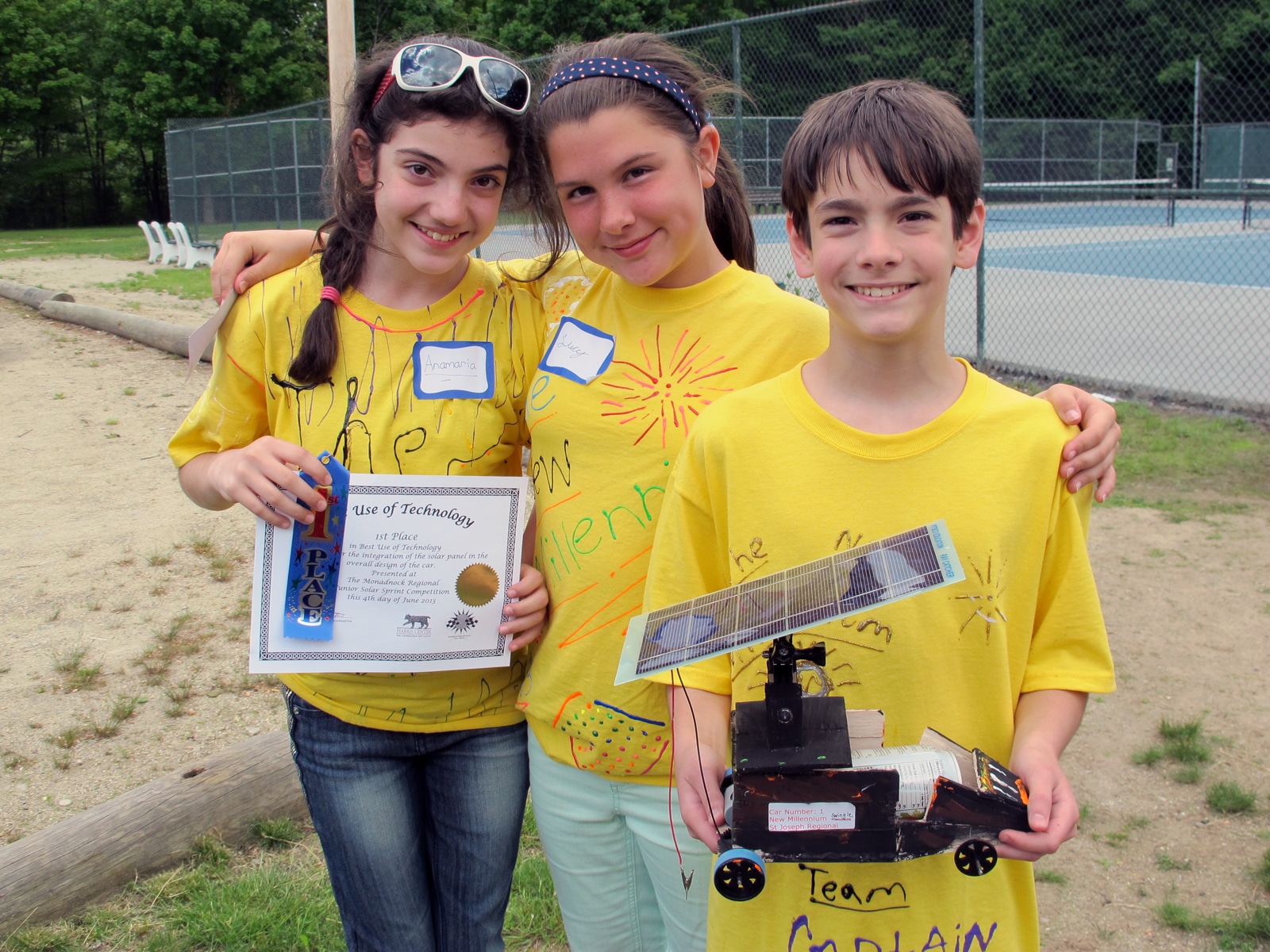 Team New Millenium from St. Joseph's School in Keene, with their solar-powered modeled car and award for Best Use of Technology. (photo © Brett Amy Thelen)