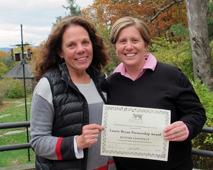 Harris Center teacher-naturalist Jenn Sutton (right) presented Jeannie Connollywith the 2014 Laurie Bryan Partnership Award.
