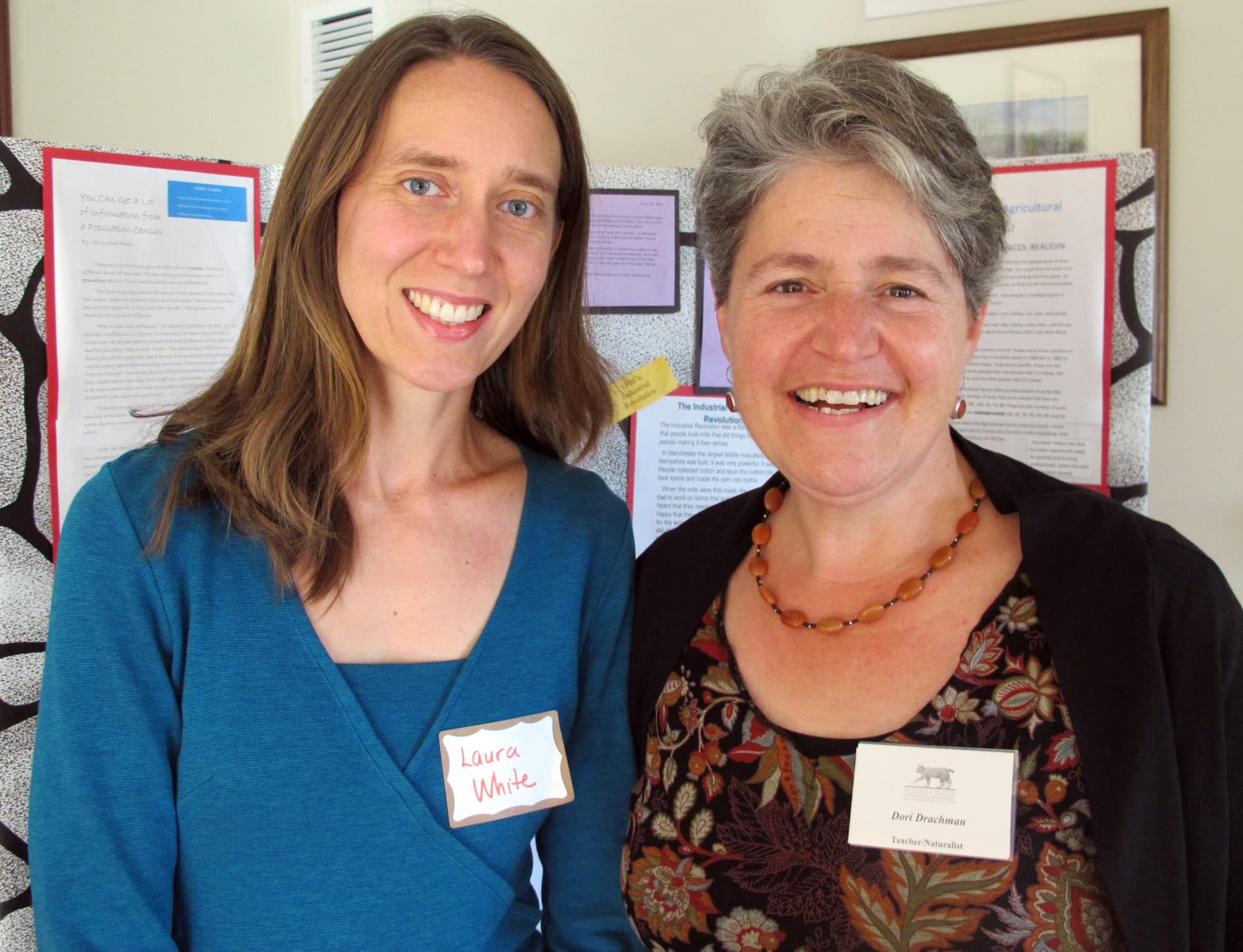 2013 Teacher of the Year Laura White and Harris Center naturalist Dori Drachman, in front of their students’ exhibit on land use history in Stoddard.