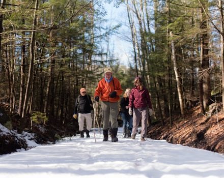 Meade Cadot leads a winter hike on the Harris Center's Jaquith Rail Trail. (photo © Ben Conant)