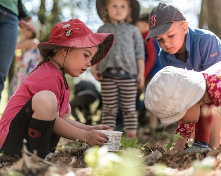 Harris Center naturalist Jaime Hutchinson leads a group of preschoolers on a search for worms. (photo © Ben Conant)