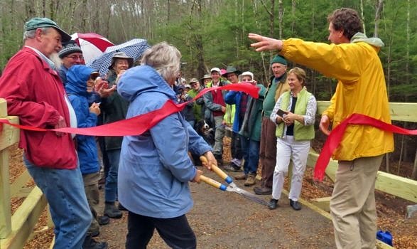 Barbara Watkins (Harrisville Trails) and Jeremy Wilson (Harris Center) cut the ribbon to officially open the new Jaquith Rail Trail on May 6, 2018. (photo © Meade Cadot)