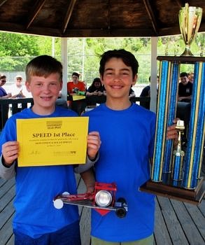 Caleb Cloutier & Carter Rousseau of South Meadow School show off their winning car (