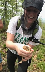 Emma Coffey, holding a toad.
