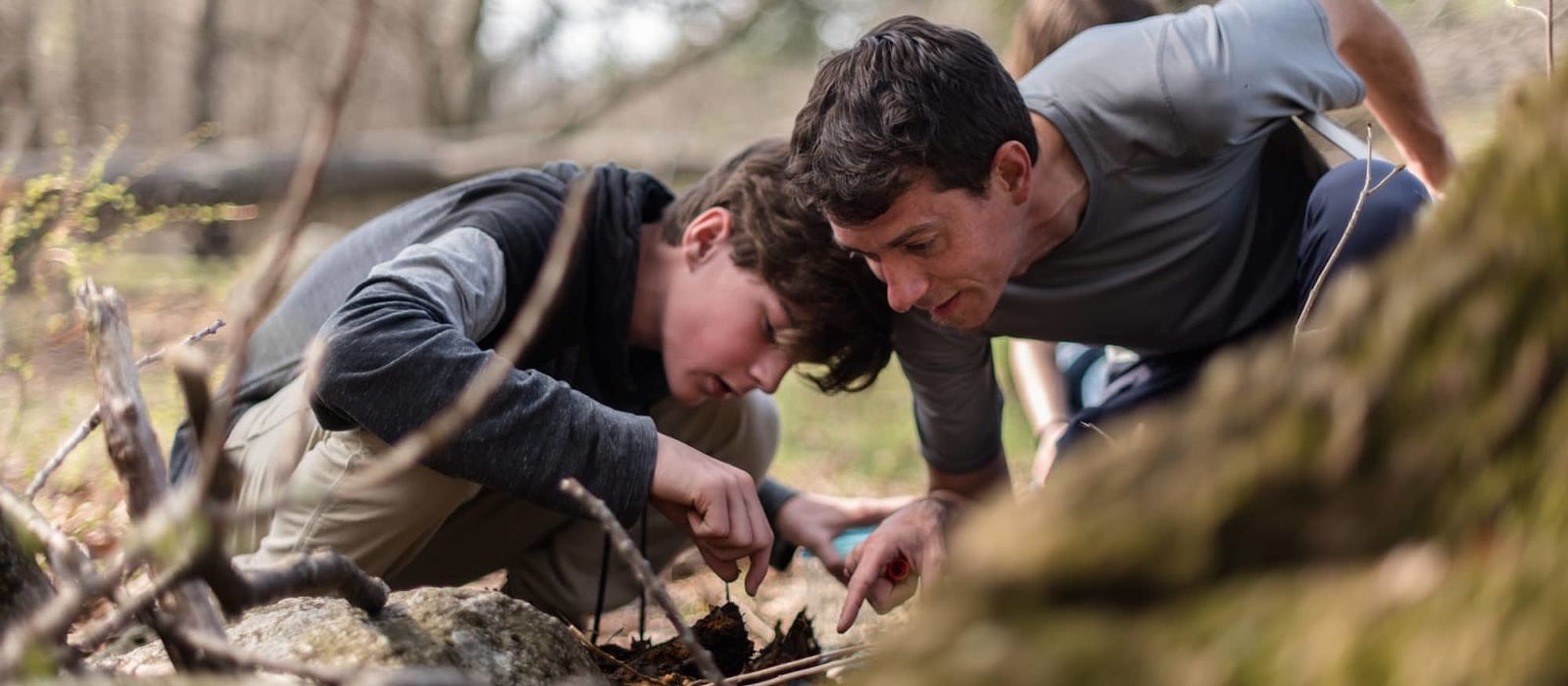 A pair of naturalists investigates leaf litter in the Harris Center woods. (photo © Ben Conant)