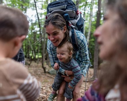 A mother and her baby smile on a Harris Center outing. (photo © Ben Conant)