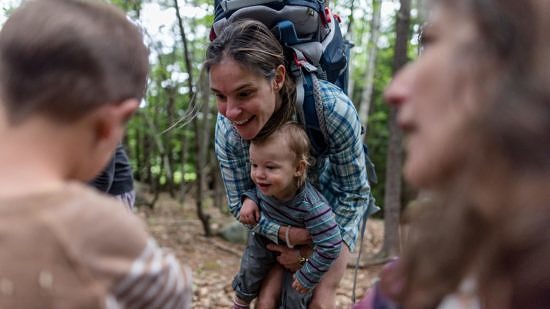 A mother and her baby smile on a Harris Center outing. (photo © Ben Conant)
