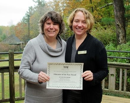 Harris Center naturalist Jenna Spear (right) presented Claudia Dery (left) with the Harris Center's 