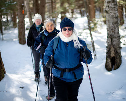 Winter hikers on the Harris Center's Hiroshi Loop Trail. (photo © Ben Conant)