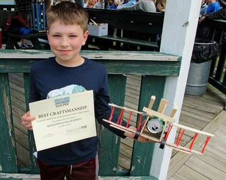 Andrew Pelkey of Jaffrey Grade School shows off his winning car (