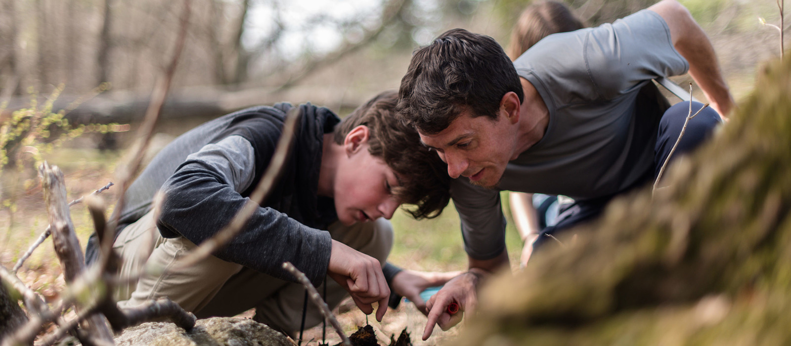 A Harris Center naturalist and a middle school student search for insects together. (photo © Ben Conant)