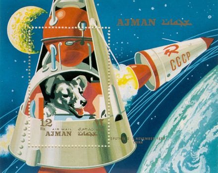 A vintage postage stamp depicting a dog in a space ship..