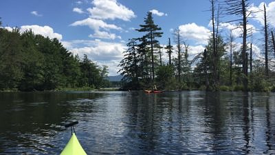 Kayakers paddle at the outlet of the Great Meadow in Harrisville. (photo © Nelson Trails Group)