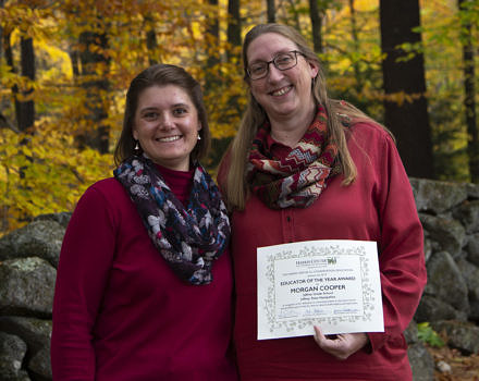 Harris Center naturalist Jaime Hutchinson (left) presented Morgan Cooper (right) with the Harris Center's 