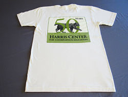 A photo of the Harris Center's 50th Anniversary commemorative tee shirt, in natural.
