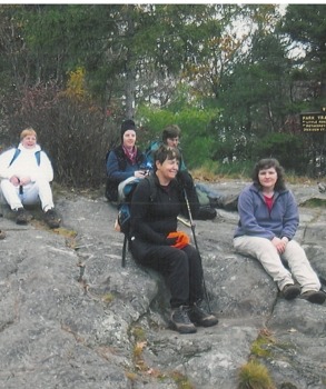 Denny shares a smile with a group of hikers on Little Monadnock Mountain. (photo © Denny Wheeler)