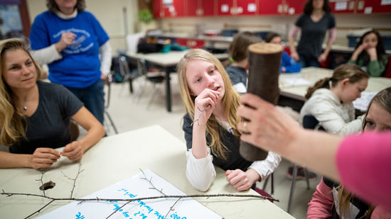 The LAB GIRLS afterschool club learns about forestry with UNH Extension Forester Karen Bennett. (photo © Ben Conant)