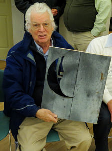 Volunteer legal counsel Stephen Froling was presented with part of an outhouse door for his land protection work -- including the removal of old outhouses -- around Silver Lake.