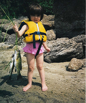 Maya shows off her catch in 1999.