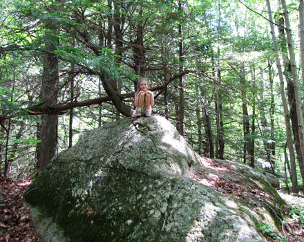 A little girl on a big boulder, during Harris Center summer camp. (photo © Jenna Spear)
