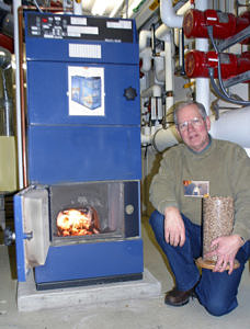 Dave Birchenough with wood pellet boiler
