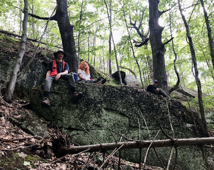 Over the course of their internship, the team surveyed nearly 30 forest inventory plots on two different parcels of Harris Center-conserved land — some of which were on steep, brambly, difficult terrain. Here, a moment of well-earned rest. (photo © Karen Seaver)