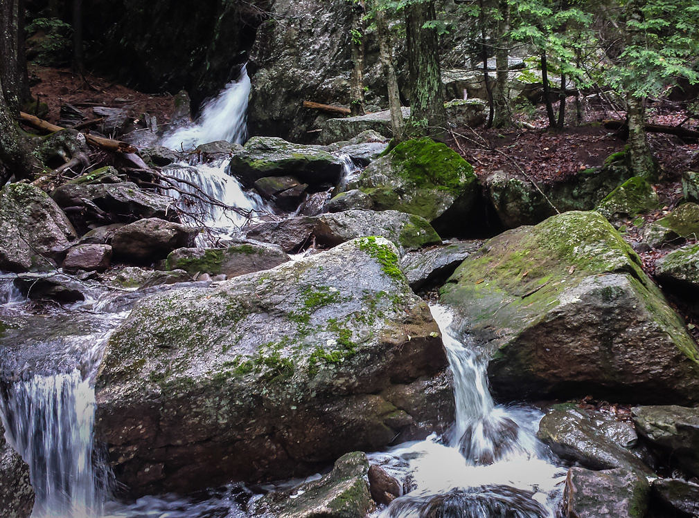A small waterfall cascading among granite blocks. (photo © Stephen Gehlbach)