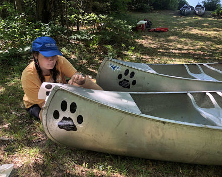 The KSC interns performed a wide range of tasks, from evening bat counts to sprucing up the canoes used by our stewardship staff and summer campers. (photo © Brett Amy Thelen)