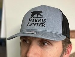 The Harris Center trucker cap, in gray.
