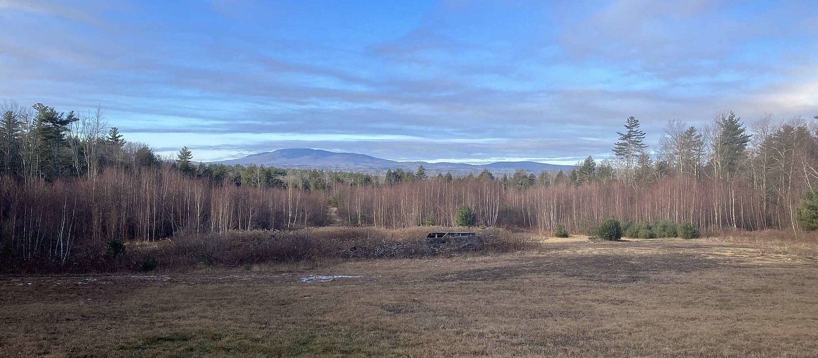 A view west across a field at Stony Brook Farm in Peterborough to Mount Monadnock in the distance. (photo © Eric Masterson)