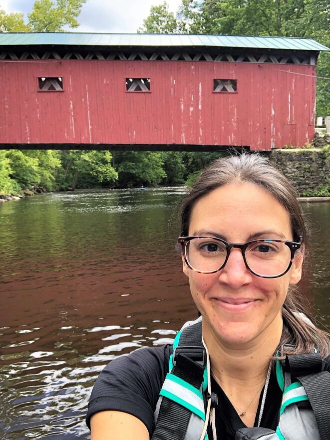 Jill Craig poses for a selfie in front of a covered bridge (photo: Jill Craig)