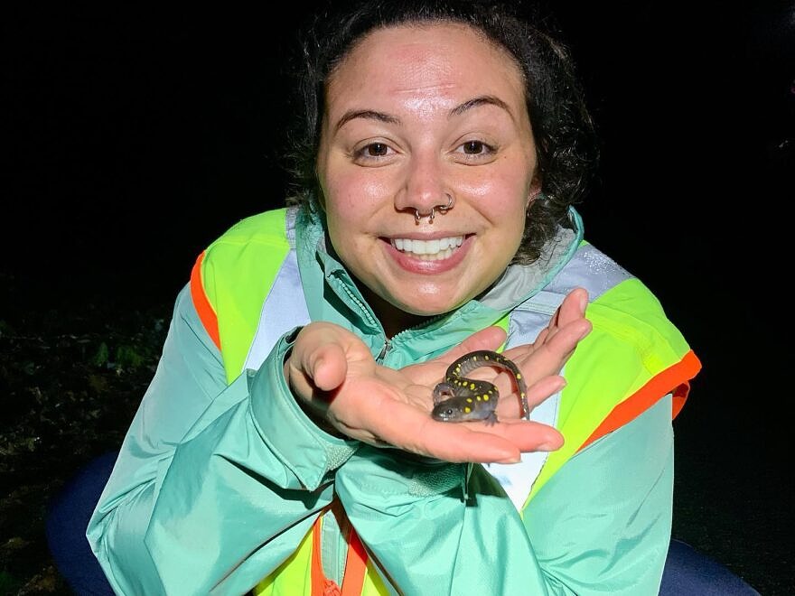 Brooke Cherry holds a spotted salamander and smiles (photo: Brooke Cherry)
