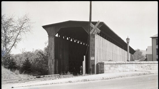 A black and white photograph of a covered railroad bridge. (photo: National Society for the Preservation of Covered Bridges)
