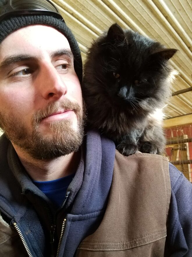 Galen Kilbride poses for a picture with a fluffy cat on his shoulder. (photo: Galen Kilbride)