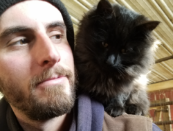 Galen Kilbride poses for a picture with a fluffy cat on his shoulder. (photo: Galen Kilbride)