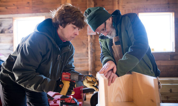 Two volunteers construct a nest box in March 2023. (photo © Ben Conant)