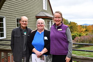 Tina Perreault (center) smiles with her husband and Janet Altobello. (photo © Audrey Dunn)