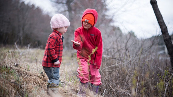 Two young children examine an object on the edge of MacDowell Lake. (photo © Ben Conant)