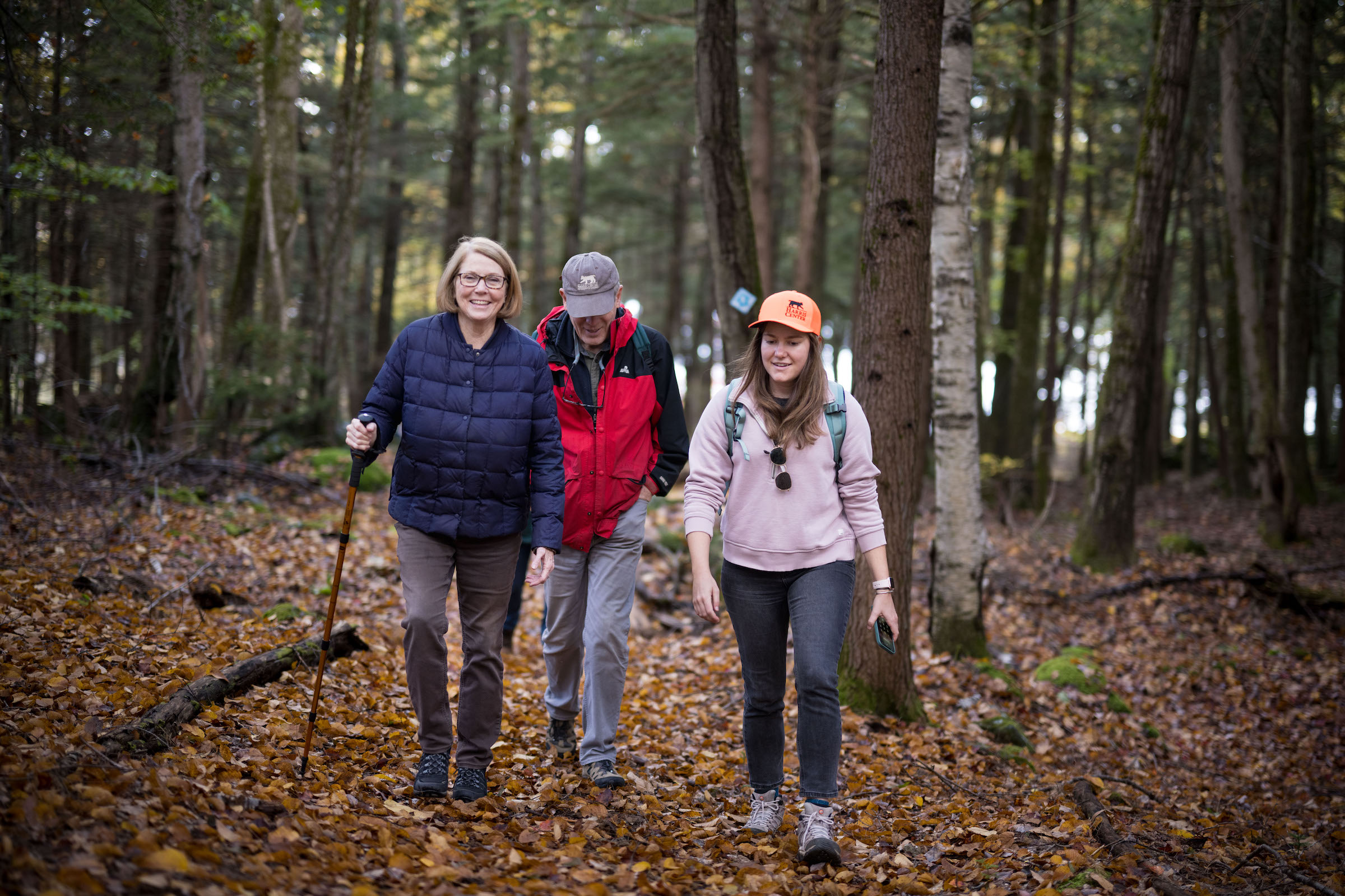 Three hikers in the woods. (photo © Ben Conant)