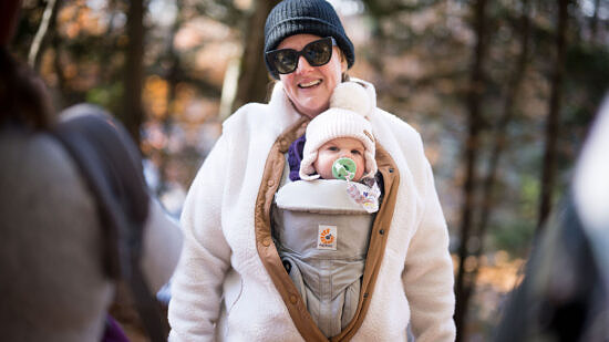 A baby sits in a front sling. (photo © Ben Conant)