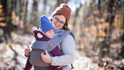A baby is held in a front sling. (photo © Ben Conant)