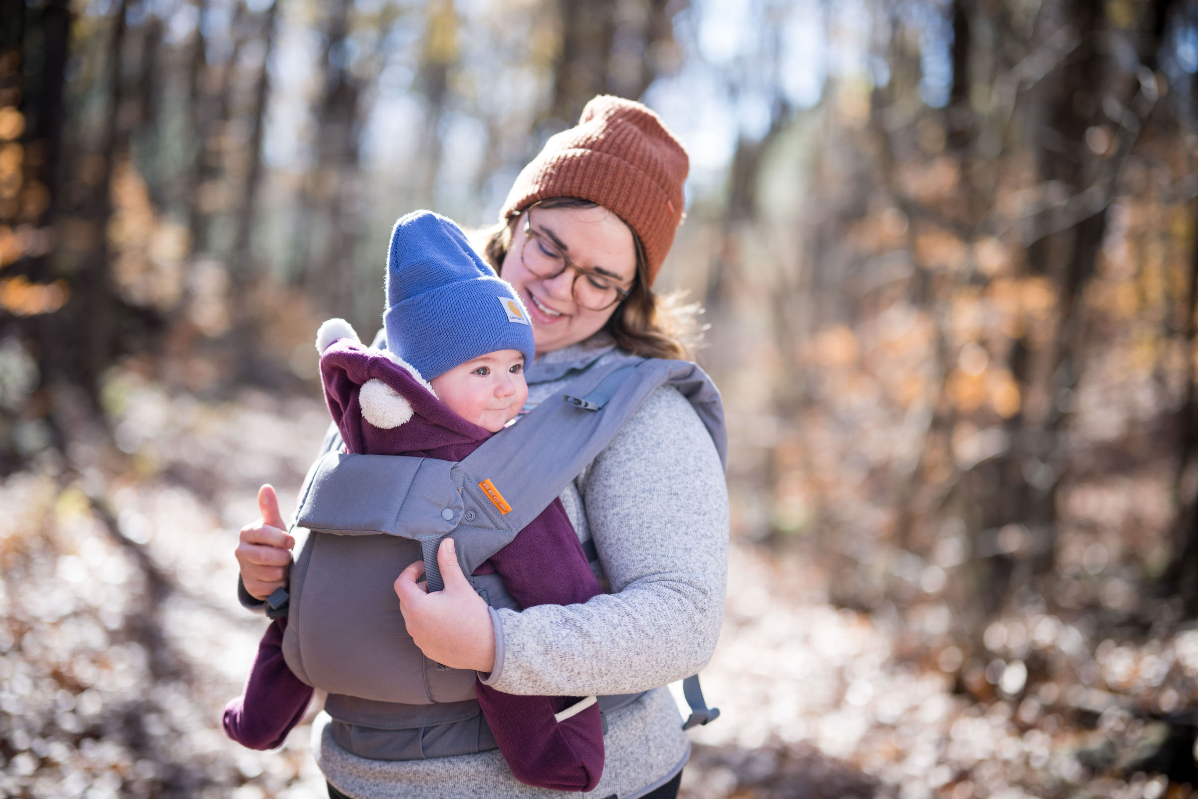 A baby is held in a front sling. (photo © Ben Conant)