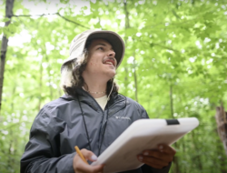 Ryan Rotigliano records data in the woods. (photo: Ben Conant)