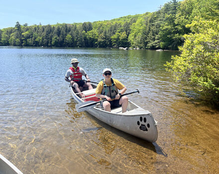 Two men canoeing in a lake (Photo © Karen Seaver)